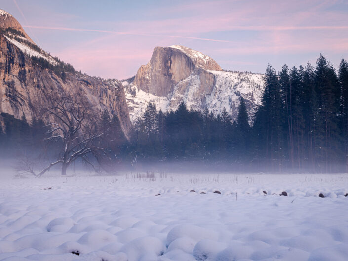 Half Dome after snow at dusk, a tranquil winter scene.